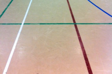 Before: Scratched sports hall floor